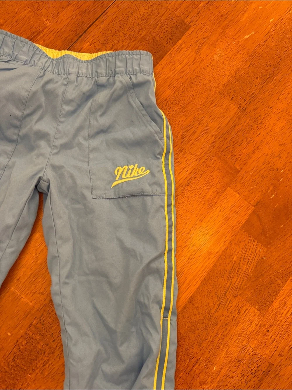 Nike Kids Blue Joggers with Yellow Side Stripes